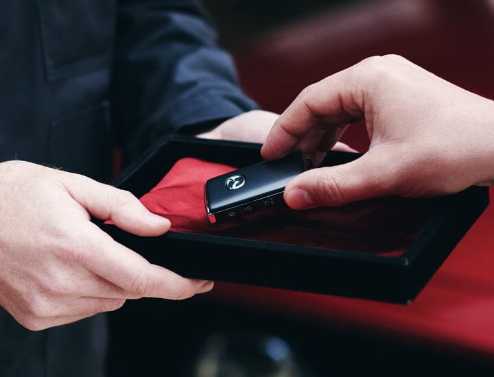 Customer Taking Vehicle Remote from Box