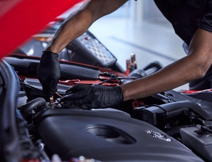 Service Technician Installing Battery
